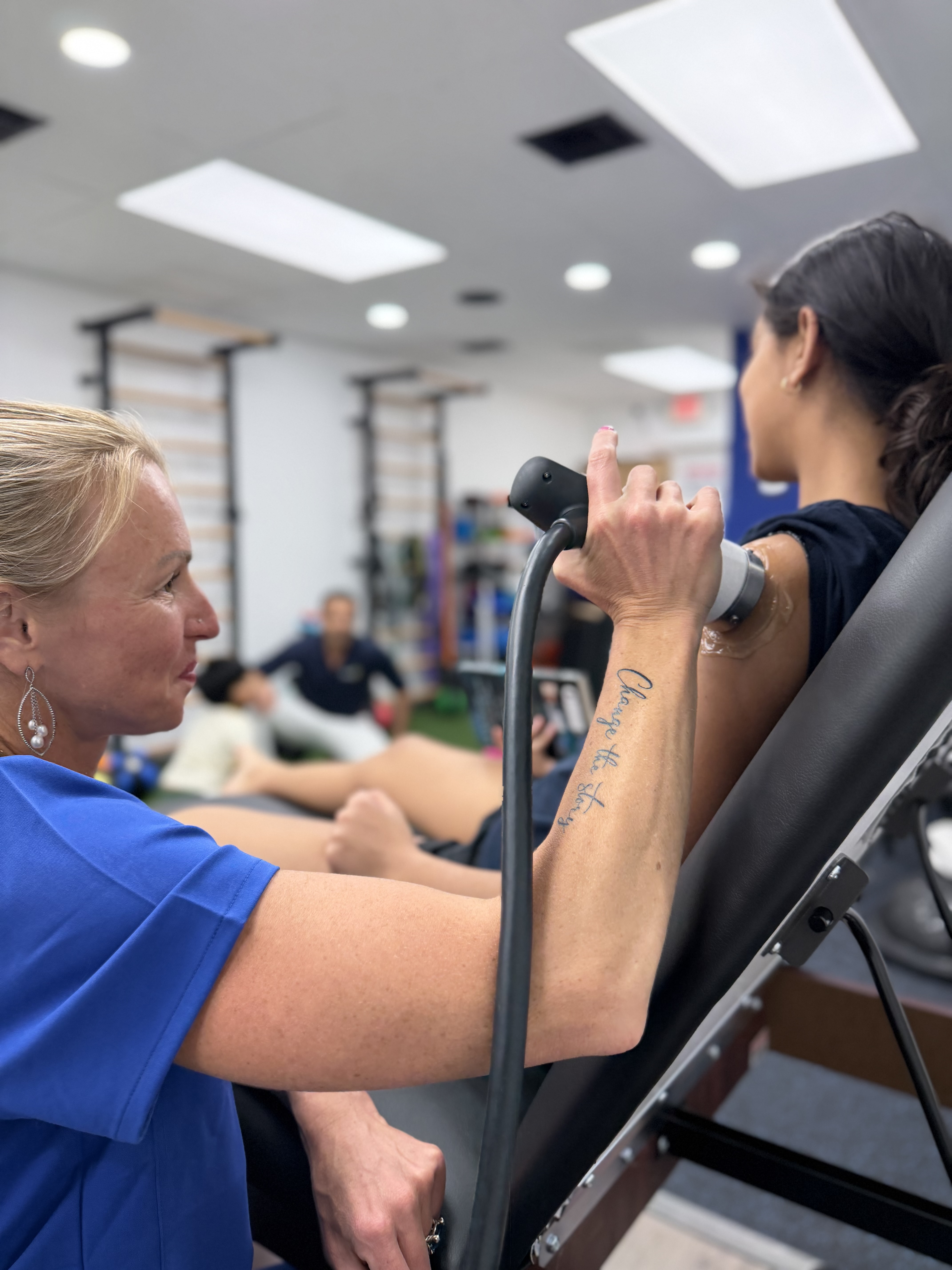 Dr. Alina providing therapeutic treatment to a patient